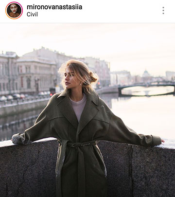 herbst foto ideen für instagram - ein mädchen auf einer brücke in einem mantel